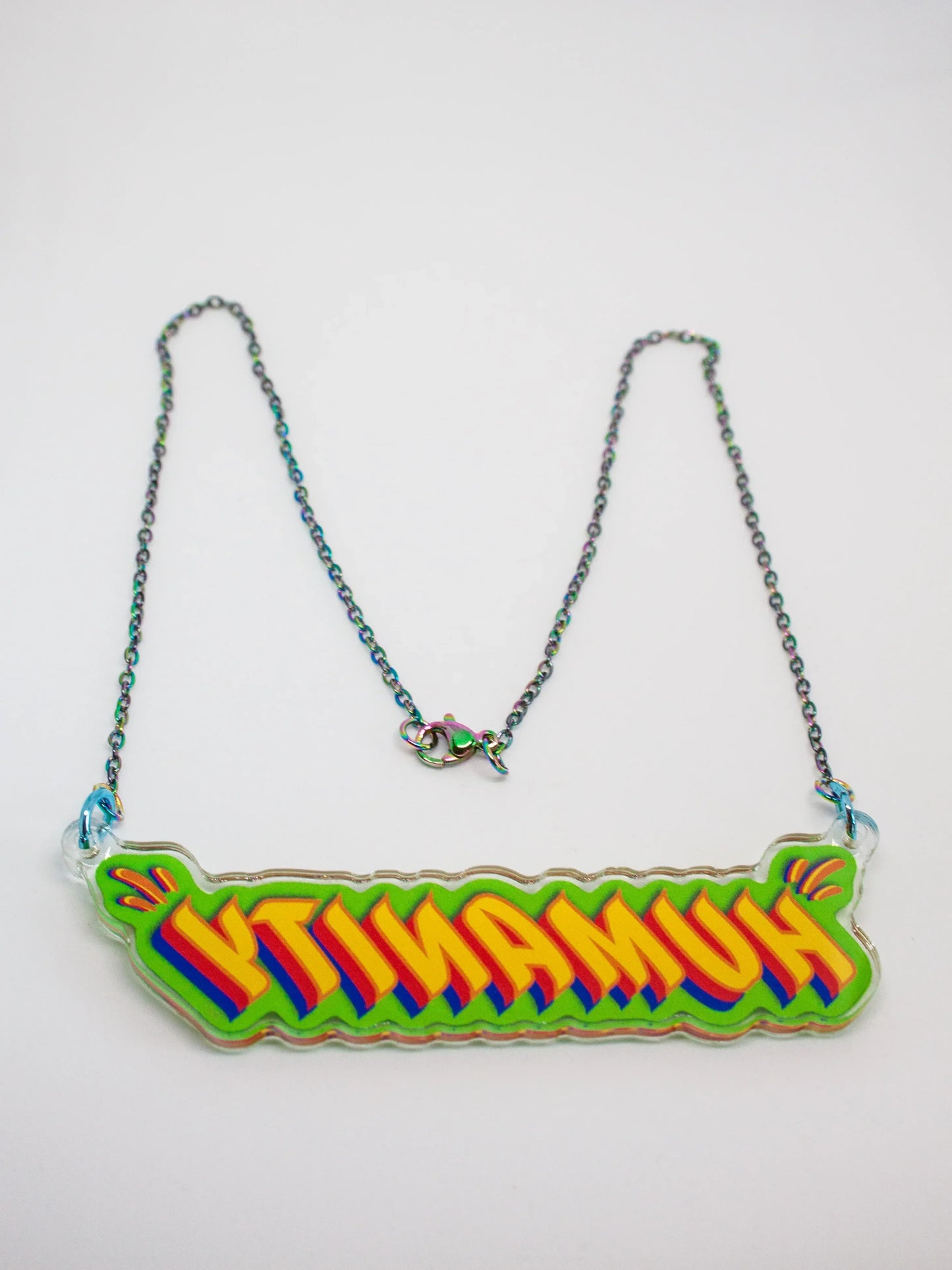 Back view of Stoofy’s ‘Humanity’ pendant necklace on a white background. Design and copyright by Stoofy 