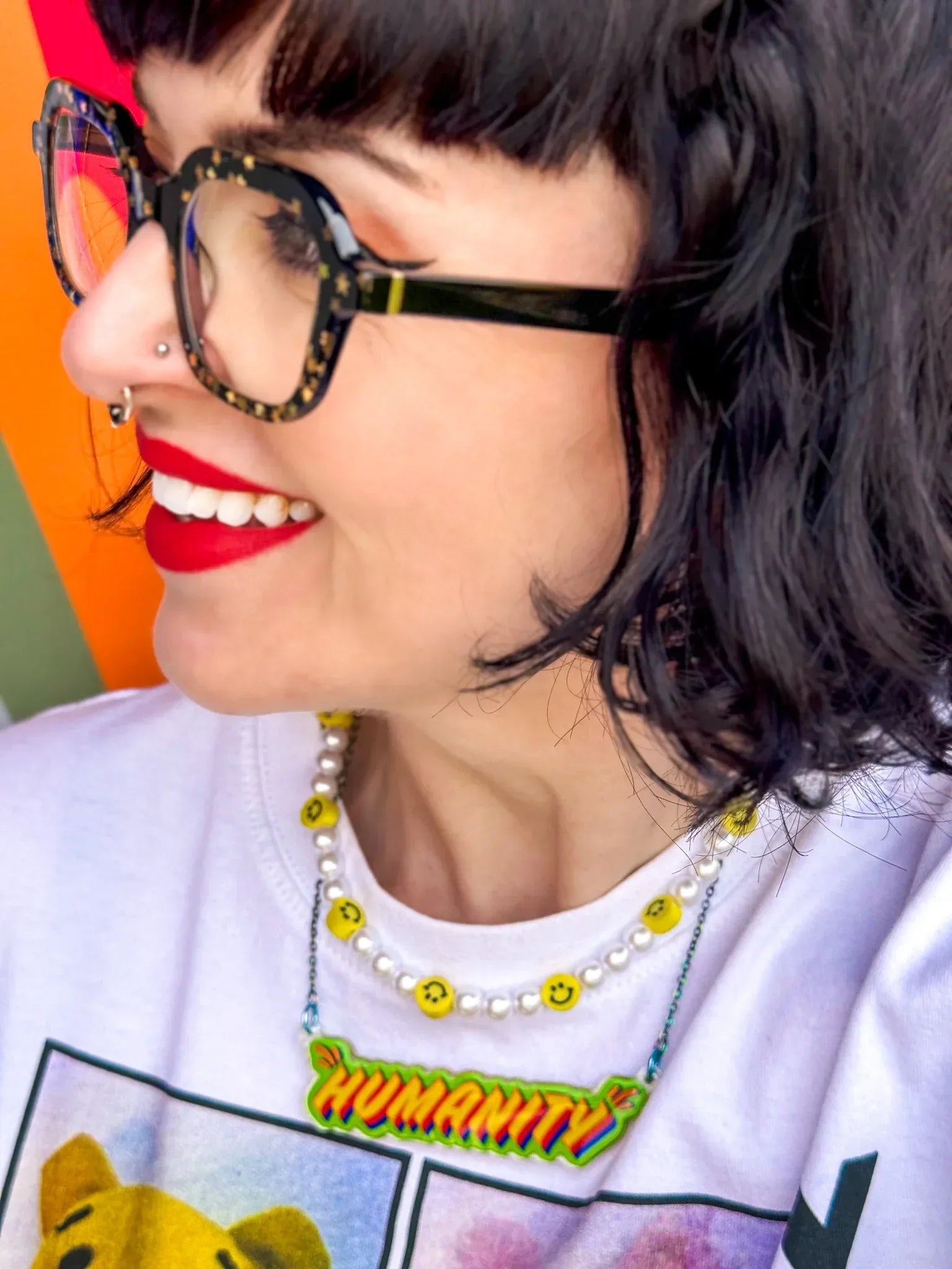 Shot of artist, Stoofy wearing ‘Humanity’ pendant necklace. Design and copyright by Stoofy. 