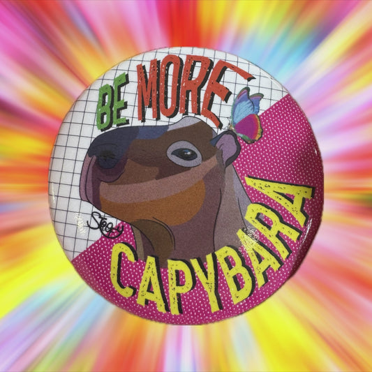 Video - Metal pin badge featuring capybara design with Be More Capybara text designed by UK artist Stoofy
